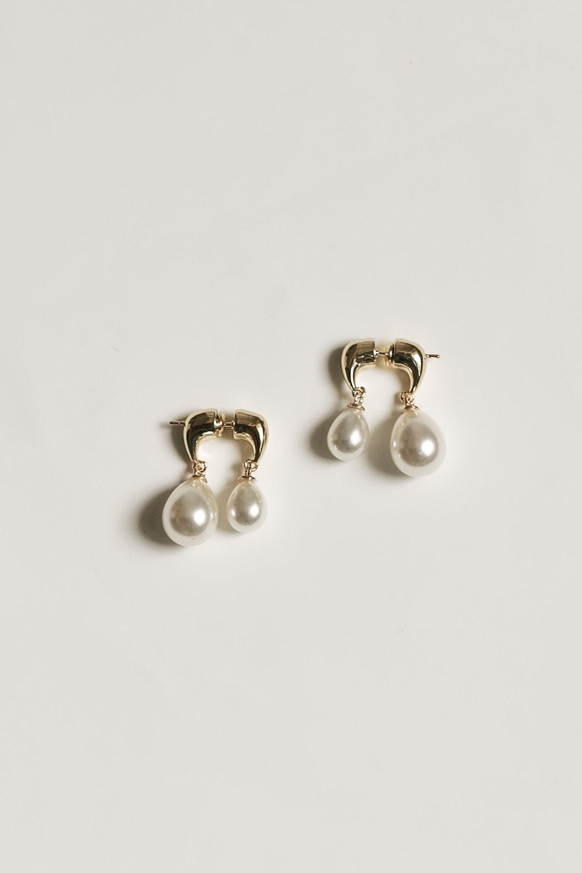 Gilded Asymmetric Pearl Drop Earrings